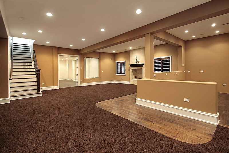 Finished Basement with Modern Flooring Lighting and Functional Living Space Transforming an Unfinished Area into a Comfortable Home Extension