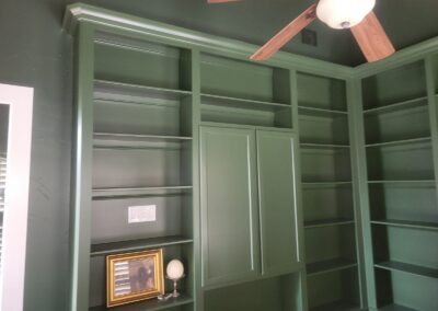 Green Library Built ins with Ceiling Fan