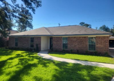 Renovated Brick Home Exterior with Fresh Landscaping Houston Heights Area