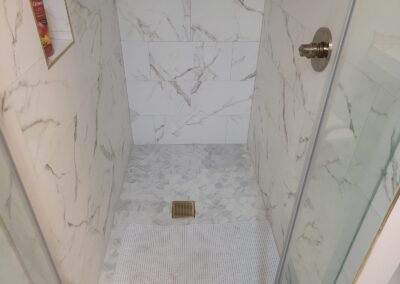 Marble Shower with Glass Enclosure